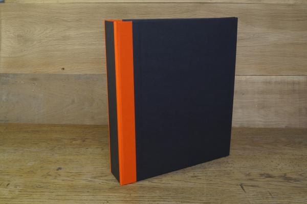 black ring binder with orange edges made of cotton fabric